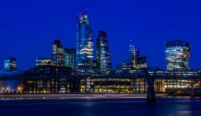 A landscape night shot of commercial buildings in the city of London